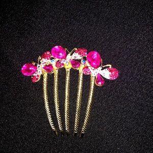 Vintage gold tone hair comb with hot pink rhinestones